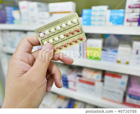 Pharmacist holding medicine capsule pack Pharmacist holding medicine capsule pack 40710788