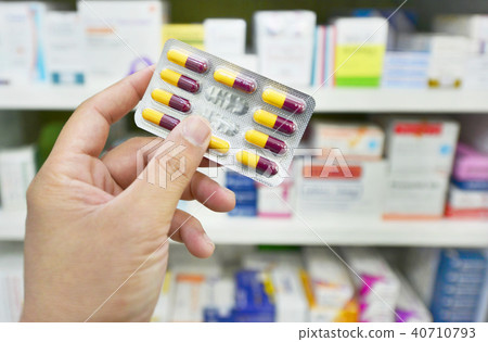 Pharmacist holding medicine capsule pack Pharmacist holding medicine capsule pack 40710793