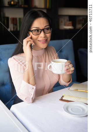 Beautiful businesswoman make call Beautiful businesswoman make call 40711711