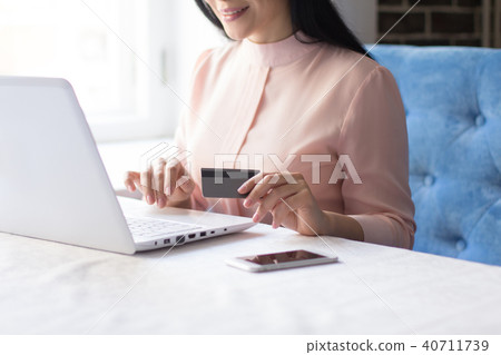 Shot of a beautiful young businesswoman using laptop Shot of a beautiful young businesswoman using laptop 40711739