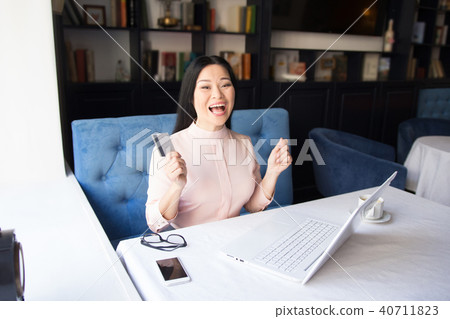 Shot of a beautiful young businesswoman using laptop Shot of a beautiful young businesswoman using laptop 40711823