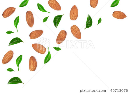 almonds decorated with leaves isolated on white background with copy space for your text. Top view almonds decorated with leaves isolated on white background with copy space for your text. Top view 40713076