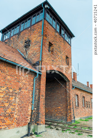 gates and railroad entering the Auschwitz Birkenau 40715241