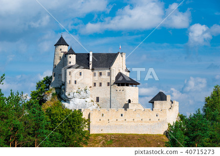 Bobolice Castle on a hill on a sunny day Bobolice Castle on a hill on a sunny day 40715273