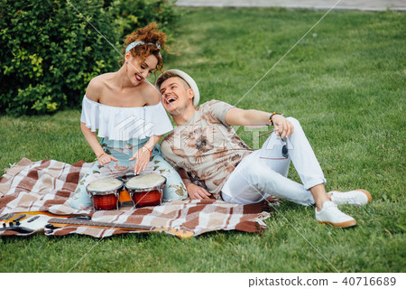 Young laughing couple playing drums 40716689