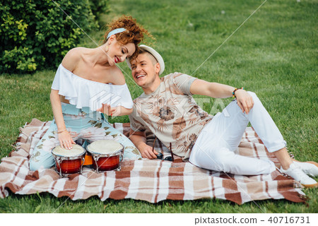 Young laughing couple playing drums 40716731