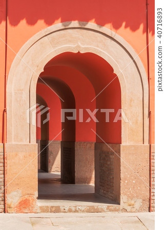 Entry of a red arch corridor in a chinese gate Entry of a red arch corridor in a chinese gate 40716893