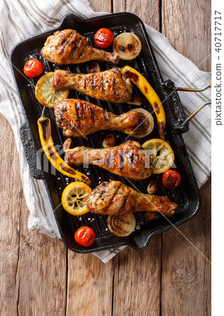 Freshly cooked grilled chicken drumstick legs 40717717