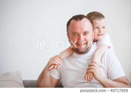 Image of young father with his son on empty background 40717809