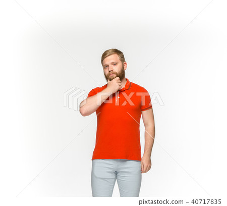 Closeup of young man's body in empty red t-shirt isolated on white background. Mock up for disign 40717835