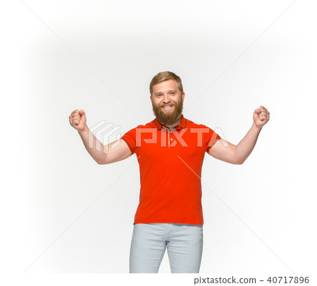 Closeup of young man's body in empty red t-shirt isolated on white background. Mock up for disign Closeup of young man's body in empty red t-shirt isolated on white background. Mock up for disign 40717896