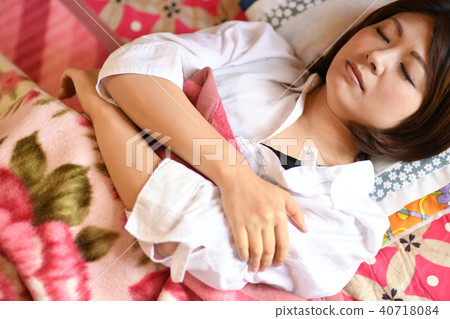 A woman who is a woman clinical thermometer who sleeps with a cold 40718084