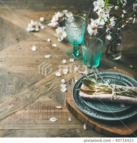Spring Easter Table setting over vintage wooden background, square crop 40718423