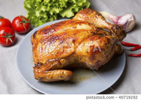 Chicken baked whole. 40719292