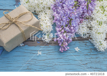 Hand made gift box and bunch of lilacs on old p Hand made gift box and bunch of lilacs on old p 40721818