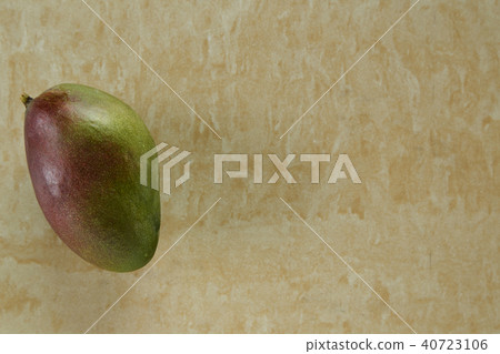 green mango on yellow marble background green mango on yellow marble background 40723106