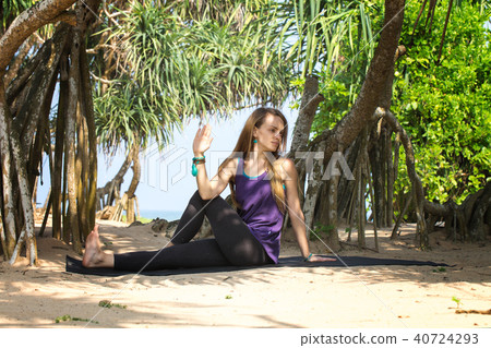 Woman doing asana on stretching 40724293