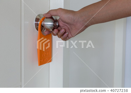 Do not disturb sign hanging at the door. 40727238