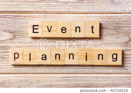 Event planning word written on wood block. Event planning word written on wood block. 40728328