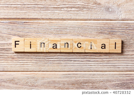 financial word written on wood block. financial word written on wood block. 40728332