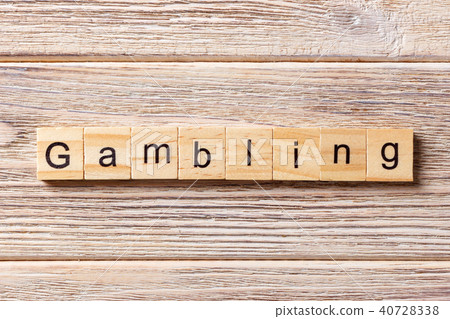 Gambling word written on wood block. Gambling word written on wood block. 40728338
