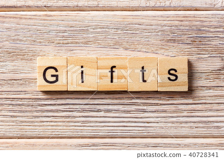 gifts word written on wood block. gifts word written on wood block. 40728341