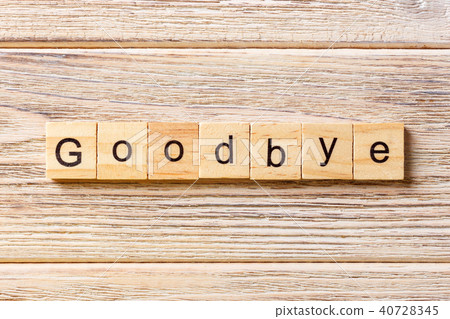 Goodbye word written on wood block. Goodbye word written on wood block. 40728345