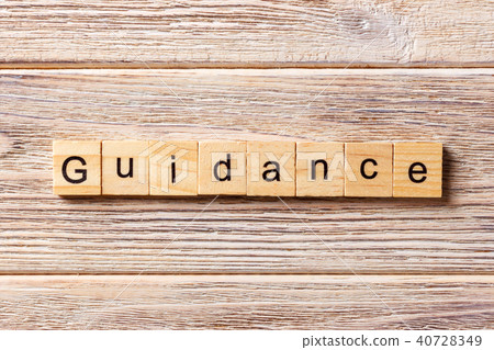 Guidance word written on wood block. Guidance word written on wood block. 40728349