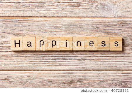 Happiness word written on wood block. Happiness word written on wood block. 40728351