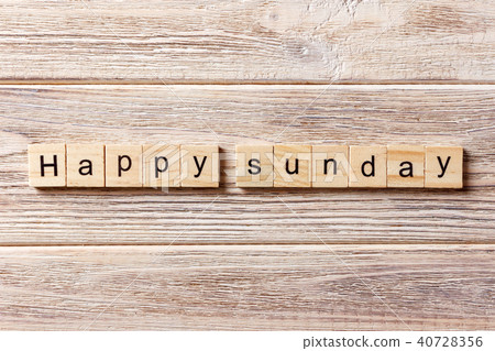 Happy sunday word written on wood block. 40728356