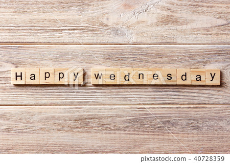 happy wednesday word written on wood block. happy wednesday word written on wood block. 40728359