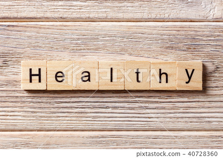 healthy word written on wood block. healthy word written on wood block. 40728360