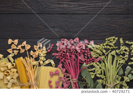 Various types of handmade pasta on black background 40729271
