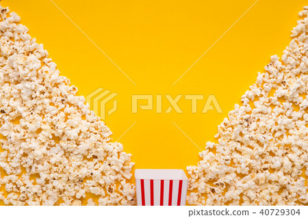 Popcorn on yellow background, top view 40729304