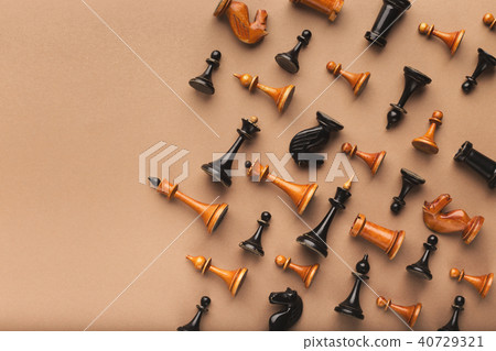 Chess figures on beige table background 40729321