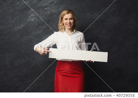 Businesswoman with blank white paper Businesswoman with blank white paper 40729358
