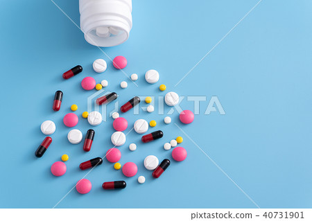 medicine  pills on blue background Copy space  40731901