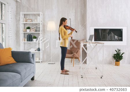 Serious violinist having serious rehearsal 40732083