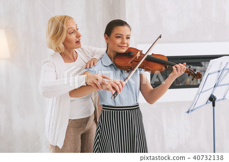 Pleased student learning new song 40732138