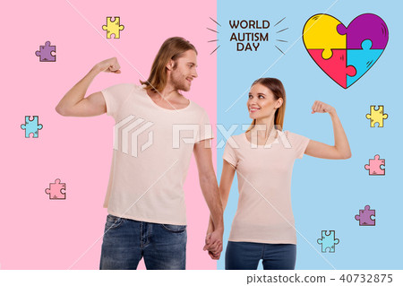 Cheerful parents looking confident on the World autism day Cheerful parents looking confident on the World autism day 40732875