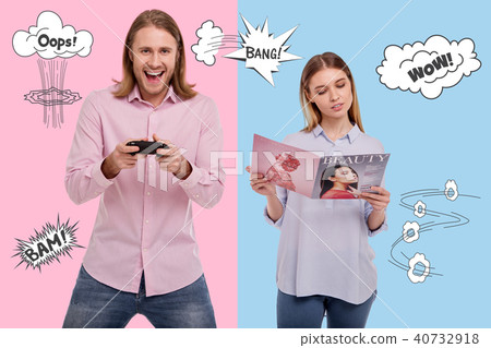 Relaxed woman reading a magazine and her excited husband playing video games Relaxed woman reading a magazine and her excited husband playing video games 40732918