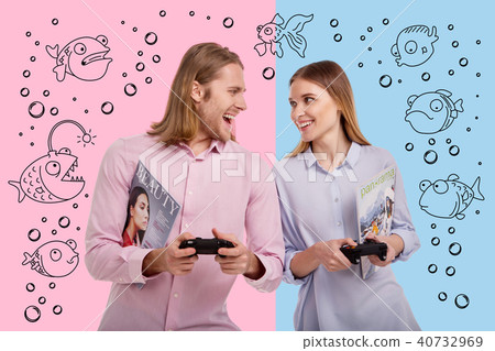 Loving couple looking at each other while winning a video game Loving couple looking at each other while winning a video game 40732969