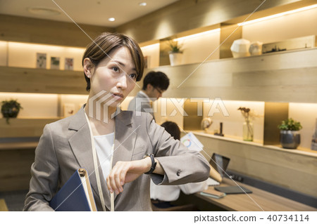 Business woman leaving the office Business woman leaving the office 40734114