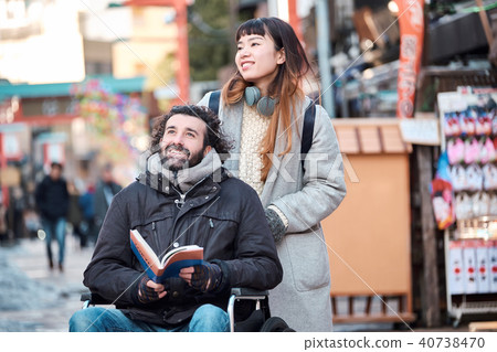 Man traveling in wheelchair 40738470