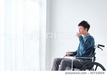 Man in wheelchair Man in wheelchair 40738804