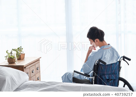 Men in a wheelchair Men in a wheelchair 40739257