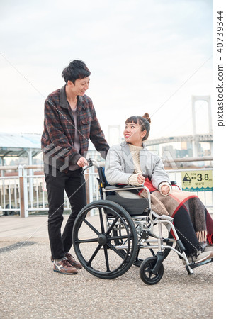 Wheelchair women and men Wheelchair women and men 40739344