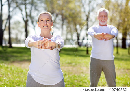 Pleasant nice woman holding her hands in front of her 40740882