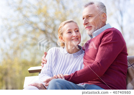 Positive handsome man hugging his wife 40740980