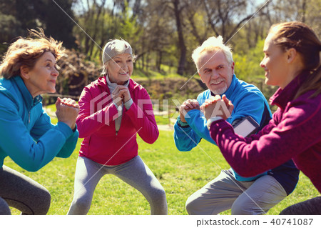 Inspired aged people exercising in the park Inspired aged people exercising in the park 40741087
